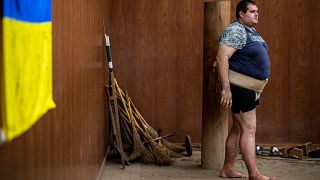 Ukrainian sumo wrestler Oleksandr Veresiuk attends a training session at a gymnastics centre in Soka, Japan