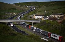 Freight lorries queue on the A20 road towards the Port of Dover on the southeast coast of England, April 26, 2022. Brexit trade checks have brought long delays. 