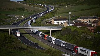 Freight lorries queue on the A20 road towards the Port of Dover on the southeast coast of England, April 26, 2022. Brexit trade checks have brought long delays.