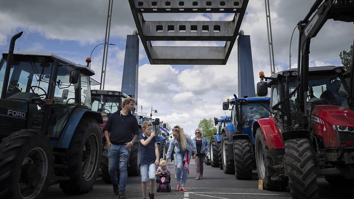 Protesting farmers block a draw bridge at a lock in the Princess Margriet canal, preventing all ship traffic from passing in Gaarkeuken, northern Netherlands, July 4, 2022.