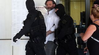 Ο πρώην βουλευτής της Χρυσής Αυγής, Γιάννης Λαγός προσέρχεται συνοδεία αστυνομικών, στο Εφετείο Αθηνών