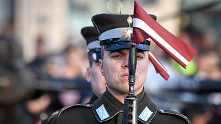 Latvian soldier takes part in a parade during a ceremony to mark 100 years of Latvia's independence in Riga, Latvia, November 18, 2018.