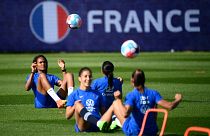 France's defender Wendie Renard (L) plays the ball during a training session at the team's base camp in Ashby-de-la-Zouch in central England, on July 5, 2022
