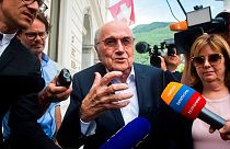 Former FIFA president Sepp Blatter is surrounded by the media as he leaves the Swiss Federal Criminal Court in Bellinzona, Switzerland, Wednesday, June 8, 2022.