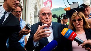 Former FIFA president Sepp Blatter is surrounded by the media as he leaves the Swiss Federal Criminal Court in Bellinzona, Switzerland, Wednesday, June 8, 2022.