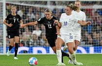 England's Georgia Stanway vies for the ball with Austria's Laura Wienroither, centre, during their Women Euro 2022 match in Manchester, England, July 6, 2022. 