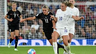 England's Georgia Stanway vies for the ball with Austria's Laura Wienroither, centre, during their Women Euro 2022 match in Manchester, England, July 6, 2022.