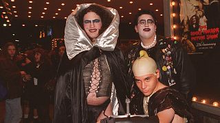 Kevan Klawitter, left, Richard Osborne, front, and Adam Nikell, right, dressed as characters from the cult classic film "The Rocky Horror Picture Show"