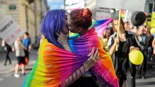 Women kiss as they take part in the Ljubljana Pride Parade in Ljubljana, on June 17, 2017.