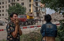 Iryna Shulimova, 59, weeps at the scene in the after math of a Russian rocket that hit a block of flats in Chasiv Yar, Donetsk region, eastern Ukraine, July 10, 2022.