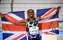 In this file photo taken on September 5, 2020 Britain's Mo Farah celebrates after victory and a world record in the men's one hour event at The Diamond League