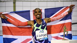In this file photo taken on September 5, 2020 Britain's Mo Farah celebrates after victory and a world record in the men's one hour event at The Diamond League