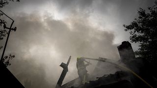 Пожарные борются с огнем после удара по Харькову