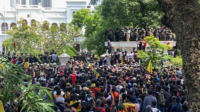 Sri Lankan protesters rally outside prime minister Ranil Wickremesinghe 's office, demanding he resign