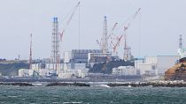 La centrale nucléaire de Fukushima Daiichi vue depuis la ville de Namie, dans la préfecture de Fukushima, au nord de Tokyo, mardi 13 avril 2021