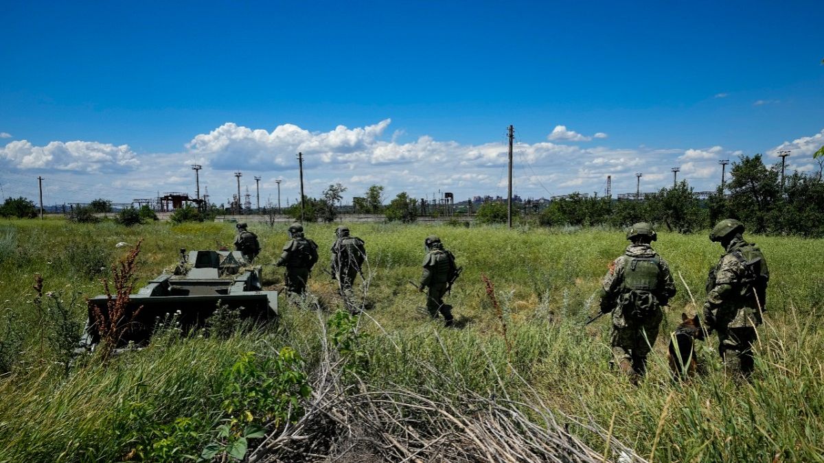 Russian mine clearing experts in territory controlled by the self-proclaimed Donetsk People's Republic, on a trip organised by the Russian Defence Ministry, July 13, 2022.