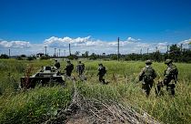Russian mine clearing experts in territory controlled by the self-proclaimed Donetsk People's Republic, on a trip organised by the Russian Defence Ministry, July 13, 2022.