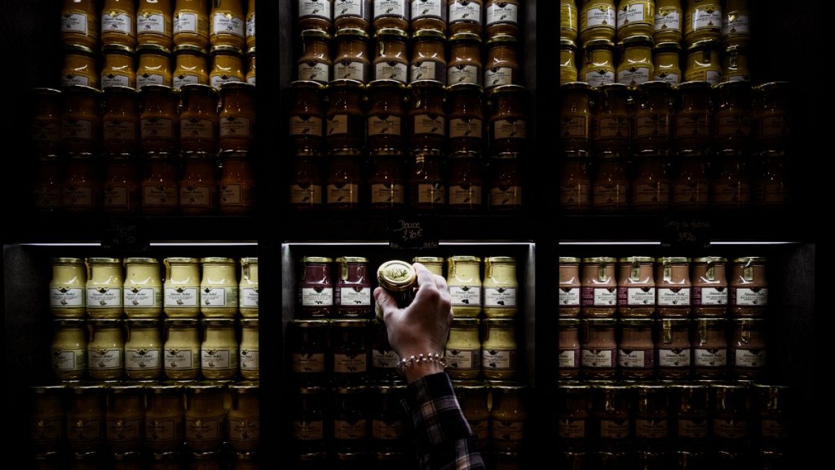 A viral video claims to show hundreds of jars of mustard piled in a warehouse.