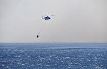 A helicopter takes part in a search and rescue operation near the eastern Aegean Sea island of Samos, Greece,