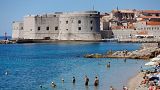 People enjoy Banje beach in Dubrovnik. Croatia is about to join the Eurozone.
