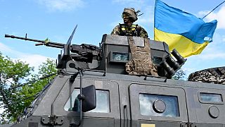A Ukrainian serviceman stands on the top of an Infantry mobility vehicle Kozak-2 in Kramatorsk, eastern Ukraine, amid the Russian invasion of Ukraine.