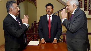 Interim President Ranil Wickremesinghe, right, greets Chief Justice Jayantha Jayasuriya during the oath-taking ceremony in Colombo, Sri Lanka, Friday, July 15, 2022.