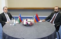 Foreign Minister of Azerbaijan Jeyhun Bayramov and Armenian Foreign Minister Ararat Mirzoyan looking on during a meeting in Tbilisi on 16 July 2022