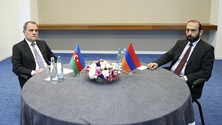 Foreign Minister of Azerbaijan Jeyhun Bayramov and Armenian Foreign Minister Ararat Mirzoyan looking on during a meeting in Tbilisi on 16 July 2022