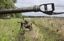 A Ukrainian serviceman prepares to fire at Russian positions from a US-supplied M777 howitzer in Kharkiv region, 14 July 2022
