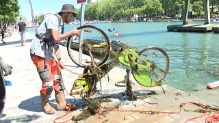 Workers clean up Paris canal, retrieve bikes and flat-screen TV