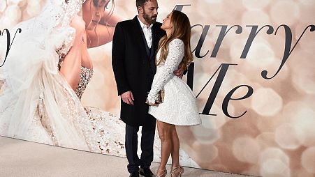 FILE - Cast member Jennifer Lopez, right, and Ben Affleck attend a photo call for a special screening of "Marry Me" at DGA Theater on Feb. 8, 2022, in Los Angeles.