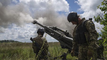 FILE - Ukrainian servicemen fire at Russian positions from a U.S.- supplied M777 howitzer in Kharkiv region, Ukraine, on Thursday, July 14, 2022.