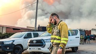 A firefighter cries near a wildfire in the Losacio area in north western Spain. July 17, 2022