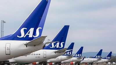 FILE - SAS planes are grounded at Oslo Gardermoen airport during pilots strikes, in Oslo, Friday, April 26, 2019.