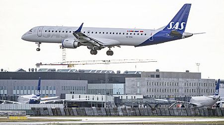 A Scandinavian airline SAS Embraer E195 aircraft comes in to land at Kastrup airport on July 4 2022