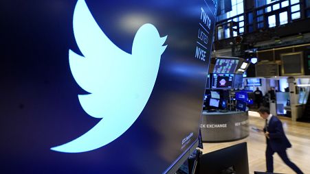 The logo for Twitter appears above a trading post on the floor of the New York Stock Exchange, Nov. 29, 2021.