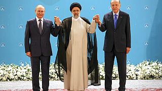 El presidente de Rusia, Vladímir Putin, junto a sus homólogos de Irán y Turquía