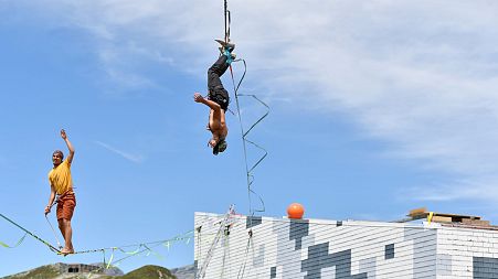 Joshua Leupolz (L) and Davis Hermes performing tricks at the Highline World Championships 2022