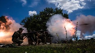 Ukrainian servicemen shoot with SPG-9 recoilless gun during training in Kharkiv region, Ukraine, Tuesday, July 19, 2022.