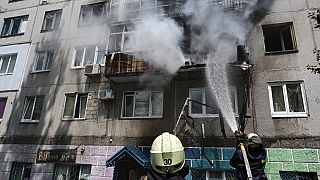 Ukrainian firefighters put out a blaze in a residential apartment, July, 2022. 