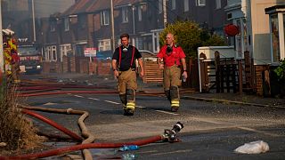 Firefighters at the scene of a blaze in the village of Wennington, east London, on Tuesday.