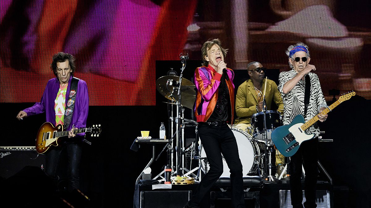 The Rolling Stones' singer Mick Jagger, guitarists Keith Richards and Ron Wood, and US drummer Steve Jordan perform during a concert in Decines-Charpieu's Stadium near Lyon