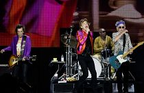 The Rolling Stones' singer Mick Jagger, guitarists Keith Richards and Ron Wood, and US drummer Steve Jordan perform during a concert in Decines-Charpieu's Stadium near Lyon
