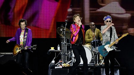 The Rolling Stones' singer Mick Jagger, guitarists Keith Richards and Ron Wood, and US drummer Steve Jordan perform during a concert in Decines-Charpieu's Stadium near Lyon