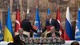 Representatives of Ukraine and Russia delegations shook hands during the signing ceremony in Istanbul