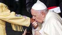 Pope Francis kisses the hand of residential school survivor Elder Alma Desjarlais of the Frog Lake First Nation as he arrives in Edmonton, Canada, on Sunday, July 24, 2022.