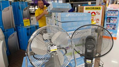 Shop employee restocks air conditioners in Marseille, southern France