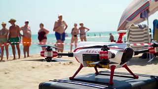 Image shows a 'lifeguard' drone on a beach in Spain.