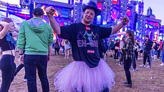 Spectators celebrate in front of the main stage of the electro festival "Airbeat One" in Neustadt-Glewe, Germany, Thursday, July 7, 2022. 