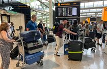 Travellers at Heathrow airport, in London, Wednesday, July 13, 2022. 